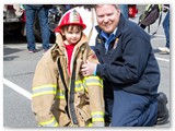 Kid in coat with Firefighter